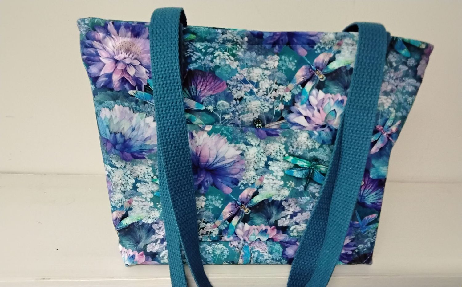 Multicolored print of flowers & dragonflies, medium blue straps