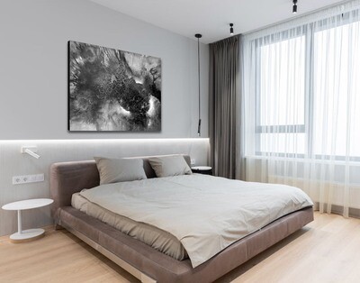 black and white art on bedroom wall