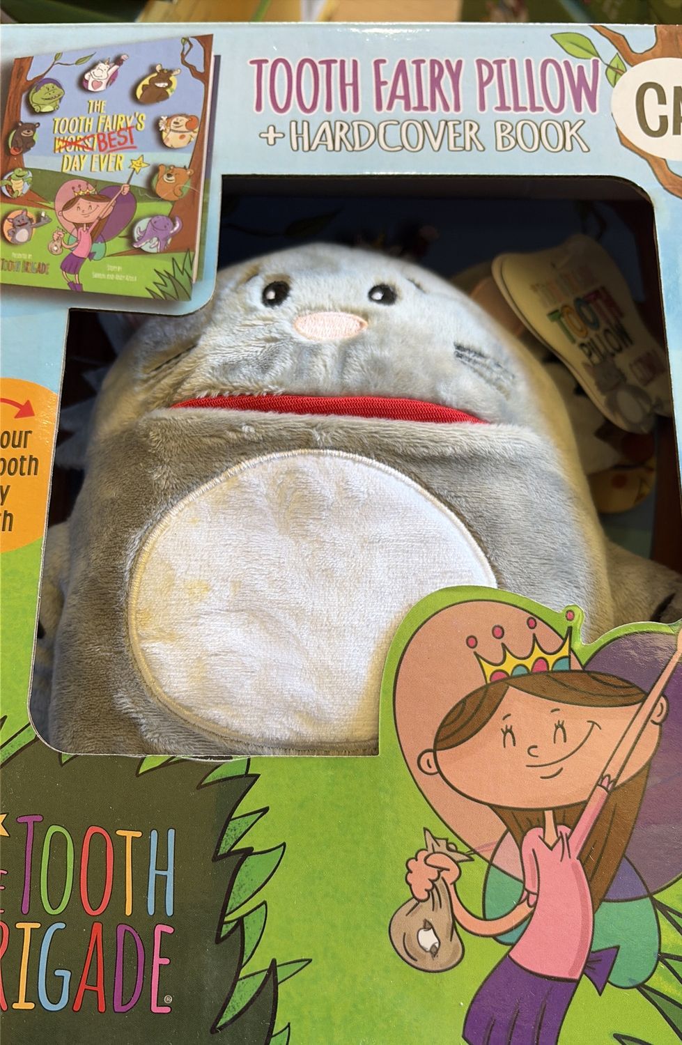The tooth brigade pillow and book cat 