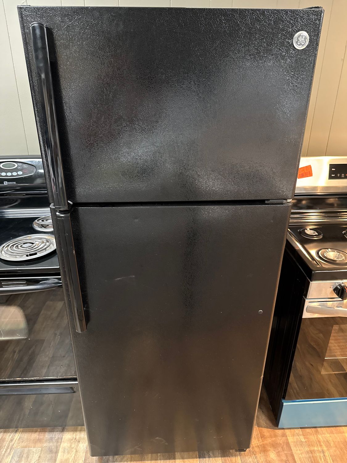 Black GE Top Freezer Refrigerator with Ice Maker