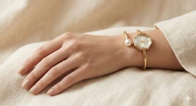Golden tone Bangle watch.