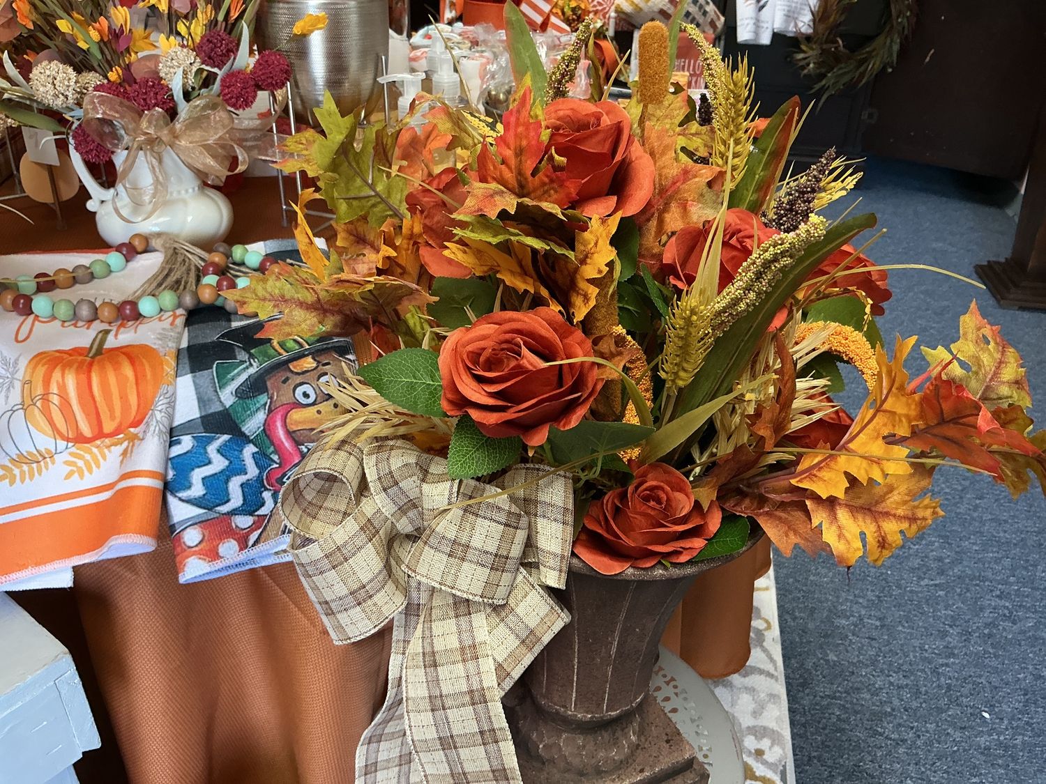 Metal containers with fall flowers and bow