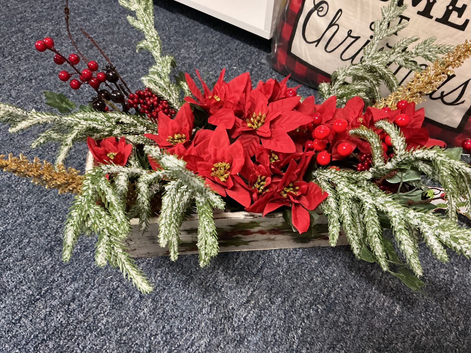 Christmas arrangement in wooden rectangle dish