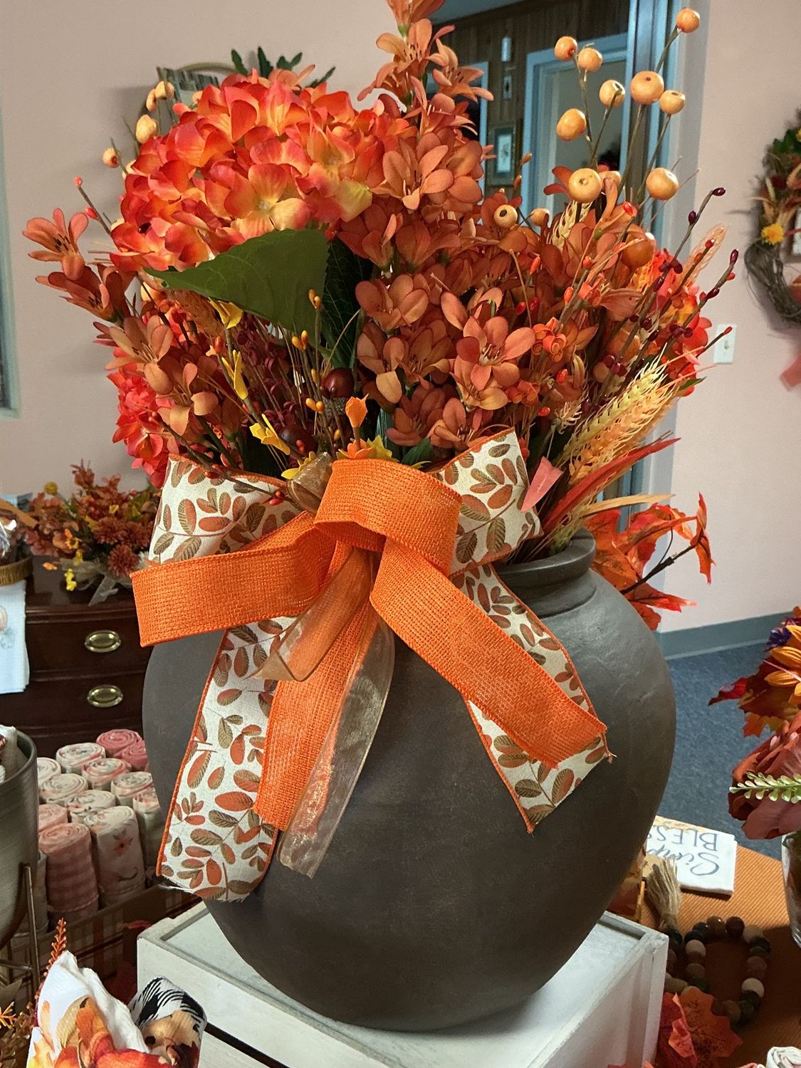 big brown pot with fall flowers