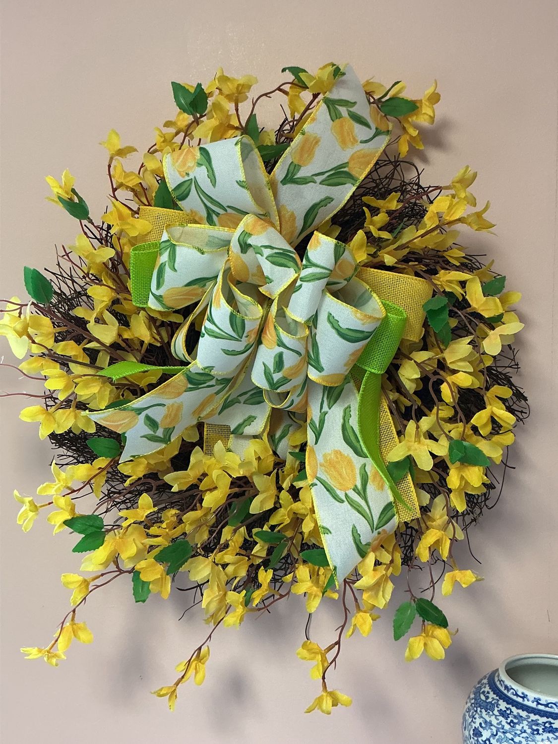 yellow wreath with yellow and green ribbon