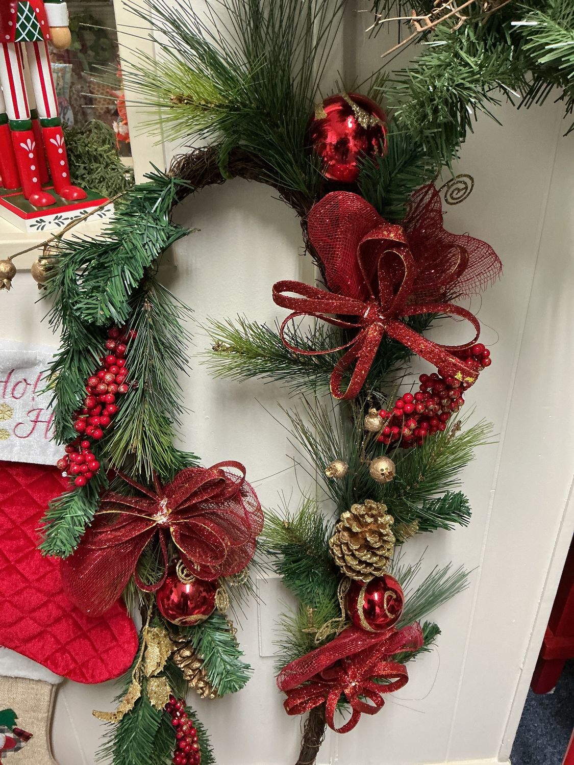 garland for mantel with red and gold berries and deer and tree ribbon