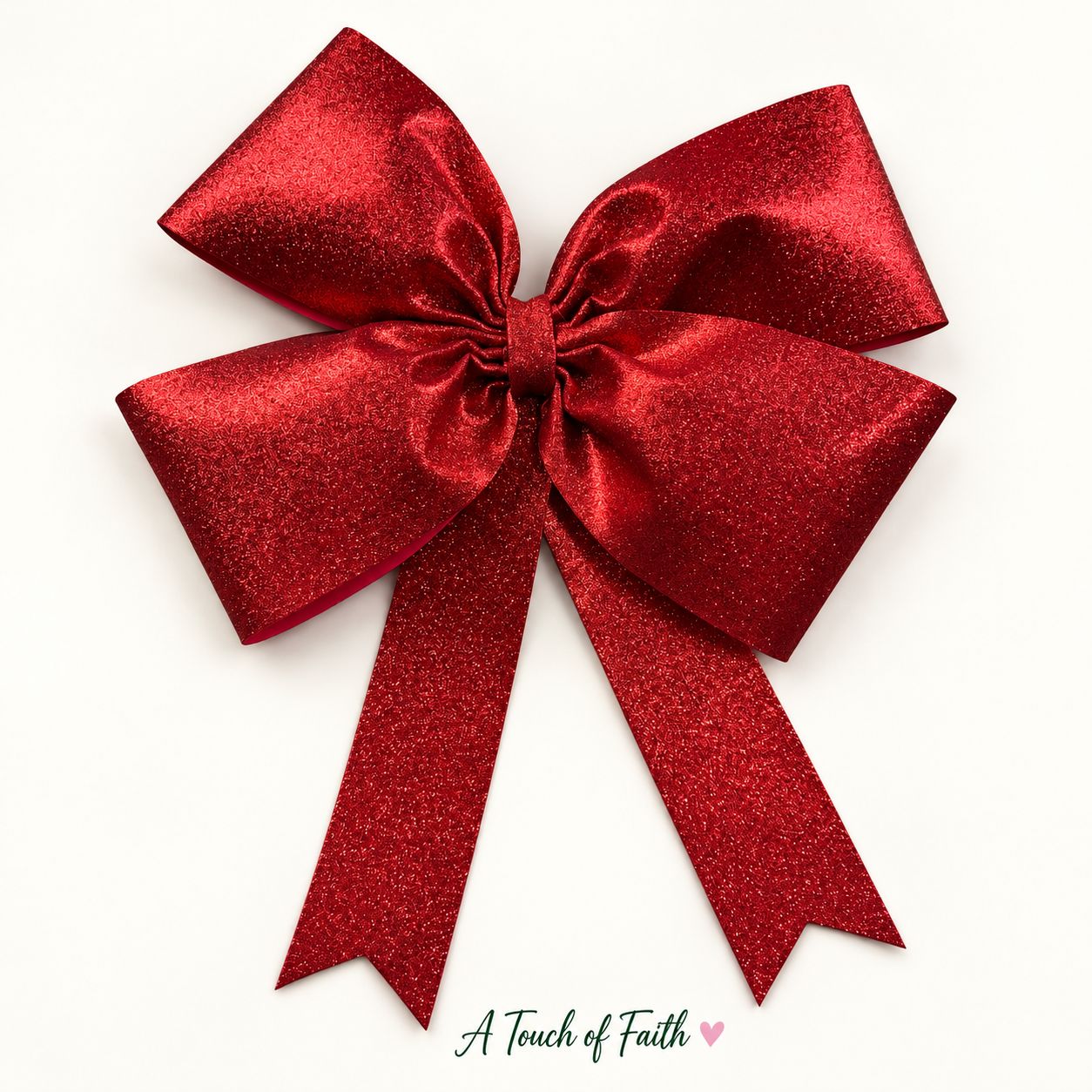 Handmade red glitter Christmas bow with four loops and long fishtail tails on a white background.