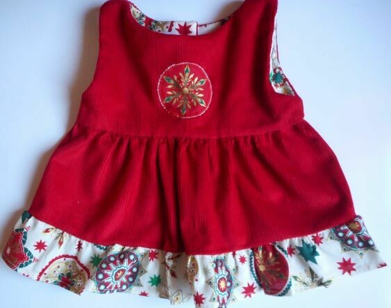 Pinafore with frill - red with x-mas print Pinafore with frill - red with x-mas print