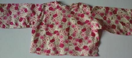 Top - Pink flowers on a cream background Top - Pink flowers on a cream background