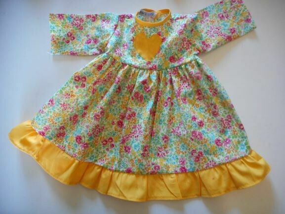 Dress, floral with contrast frill in yellow.