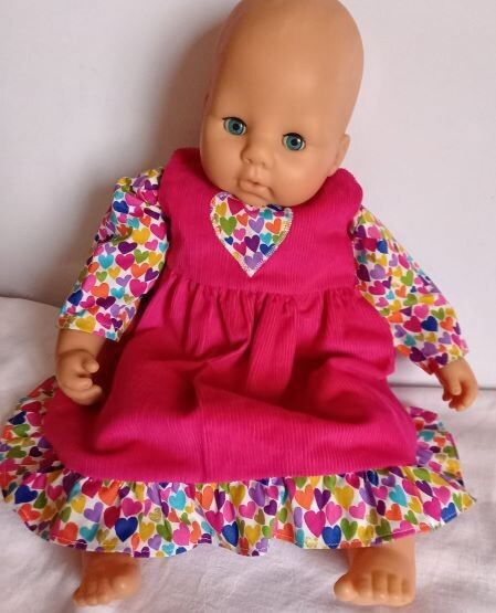 Outfit: Cerise pink pinafore with frill and matching top for dolls. 2 pieces. NEW!
