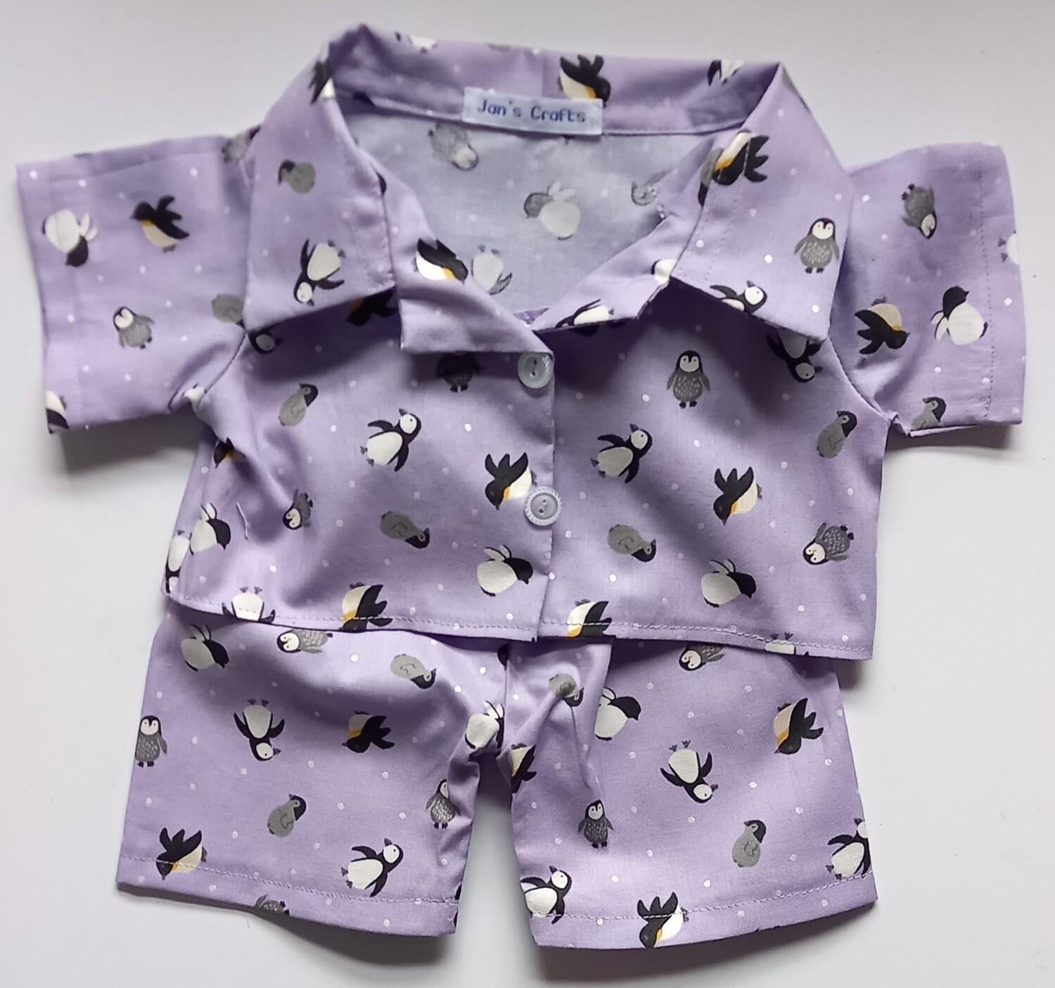 Pyjamas with collar - penguins on a lilac background print.