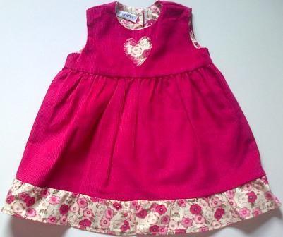 Pinafore with frill for dolls- cerise pink Pinafore with frill for dolls- cerise pink