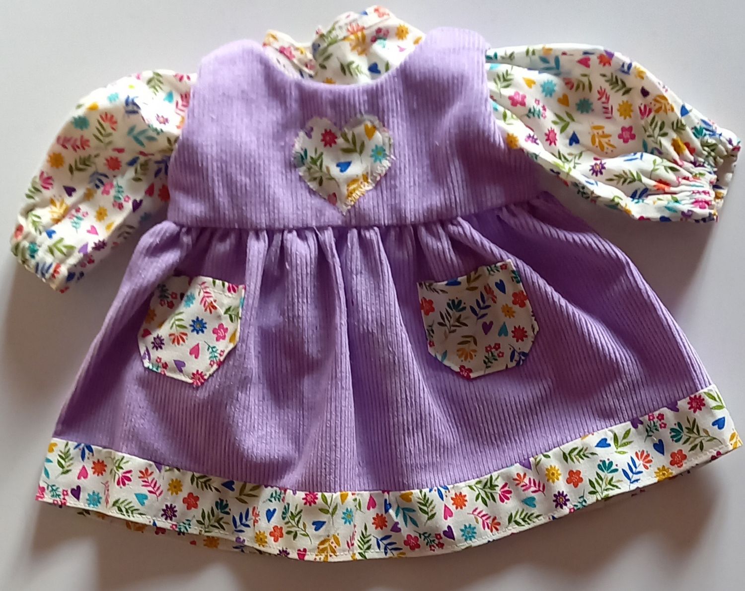 Lilac pinafore with matching top for 36cm doll.