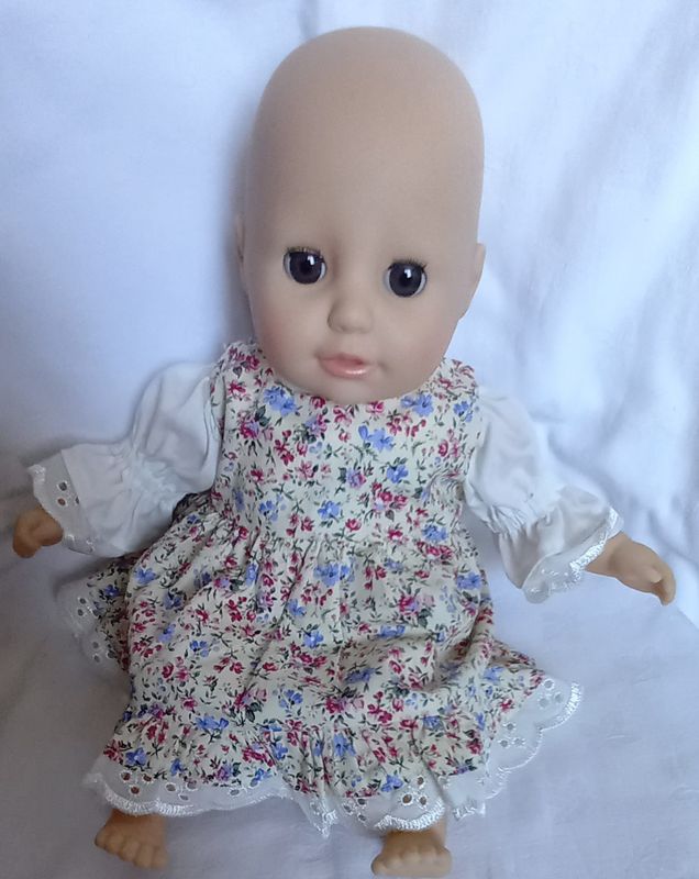 Pinafore with lace edged sleeved top for 36cm doll.