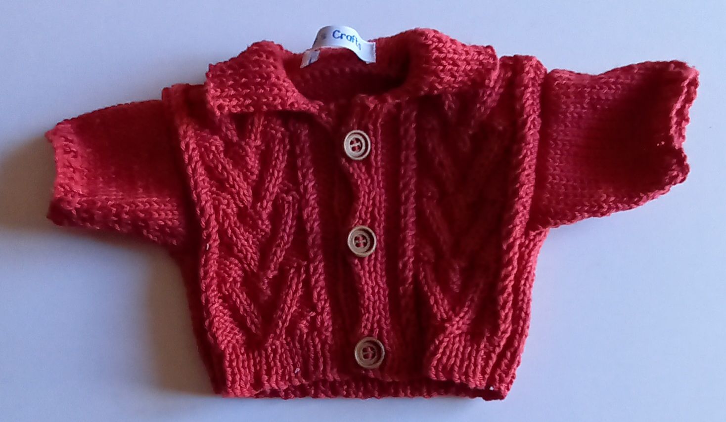 Cardigan with collar - brick red with cable pattern on front