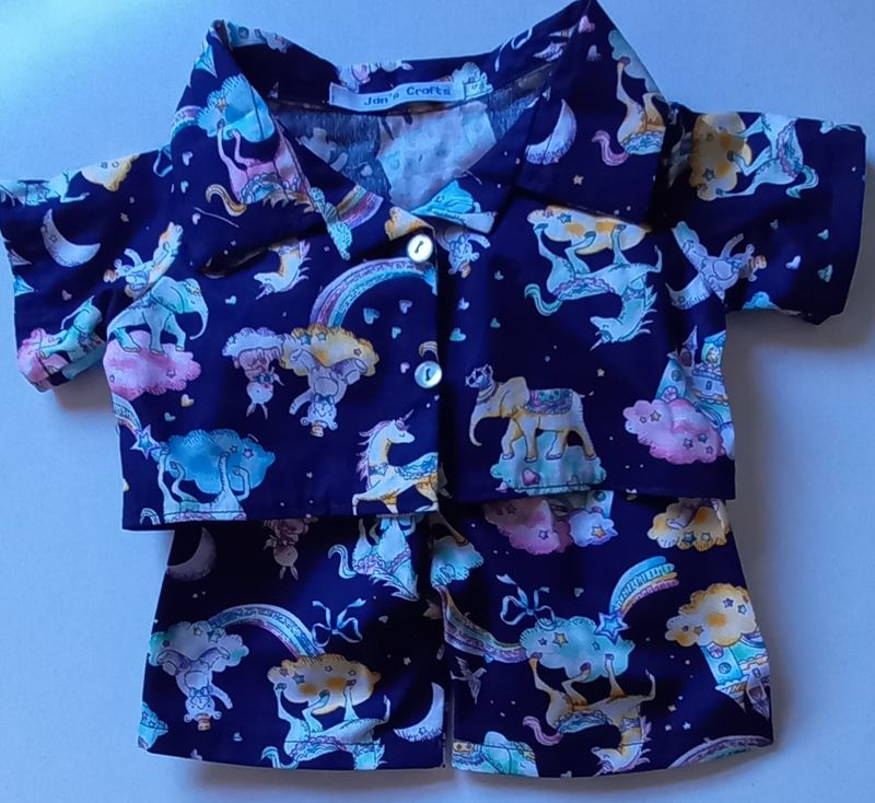 Pyjamas with collar - in a unicorn, fairy tale castle print.
