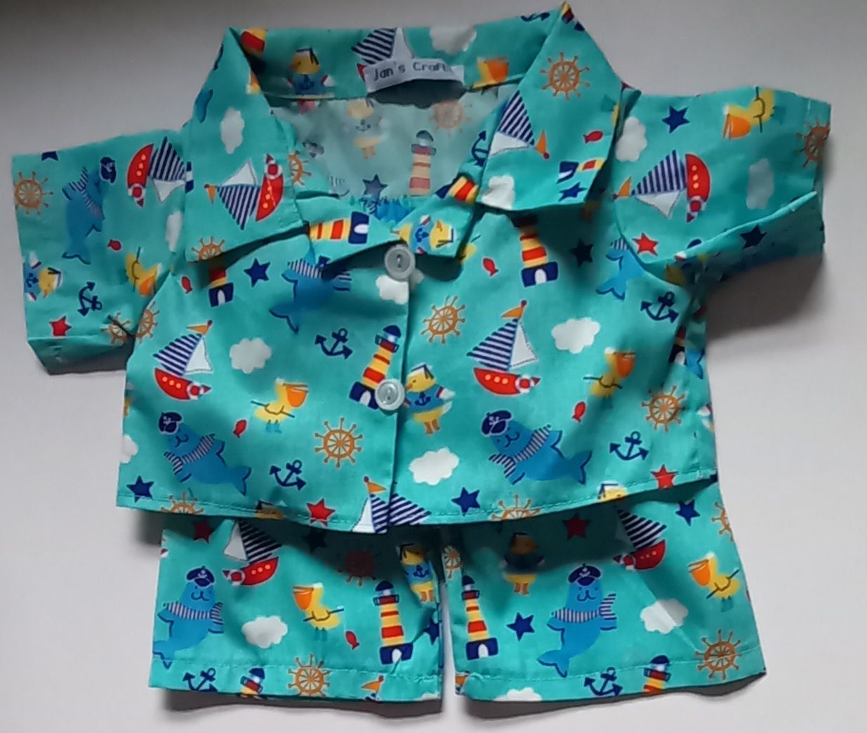 Pyjamas with collar - turquoise with sailing theme print.