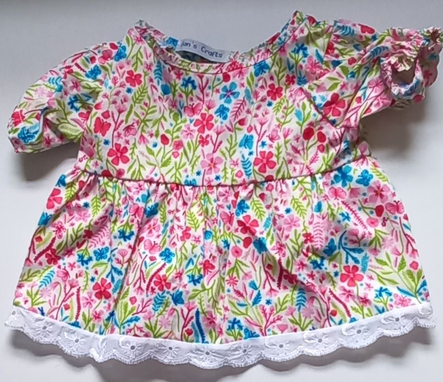 Dress: floral print and lace edged.