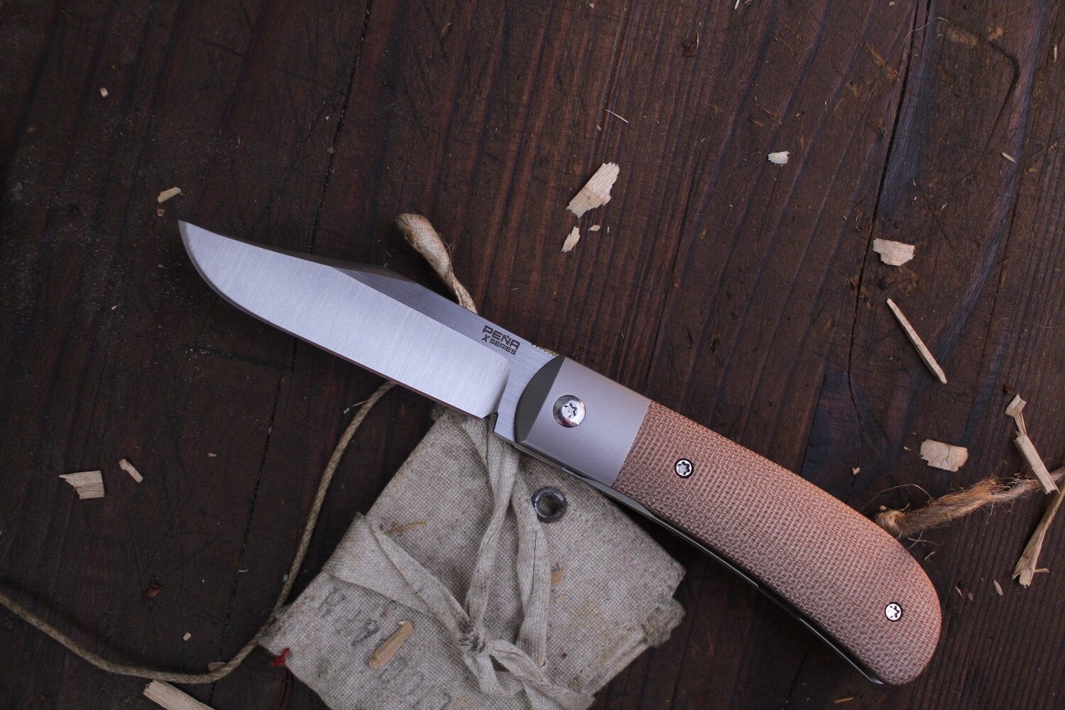 Pena X Series Lanny&#39;s Clip 3.15&quot; Front Flipper / Natural Canvas Micarta &amp; Titanium Bolsters / Satin Clip Point M390