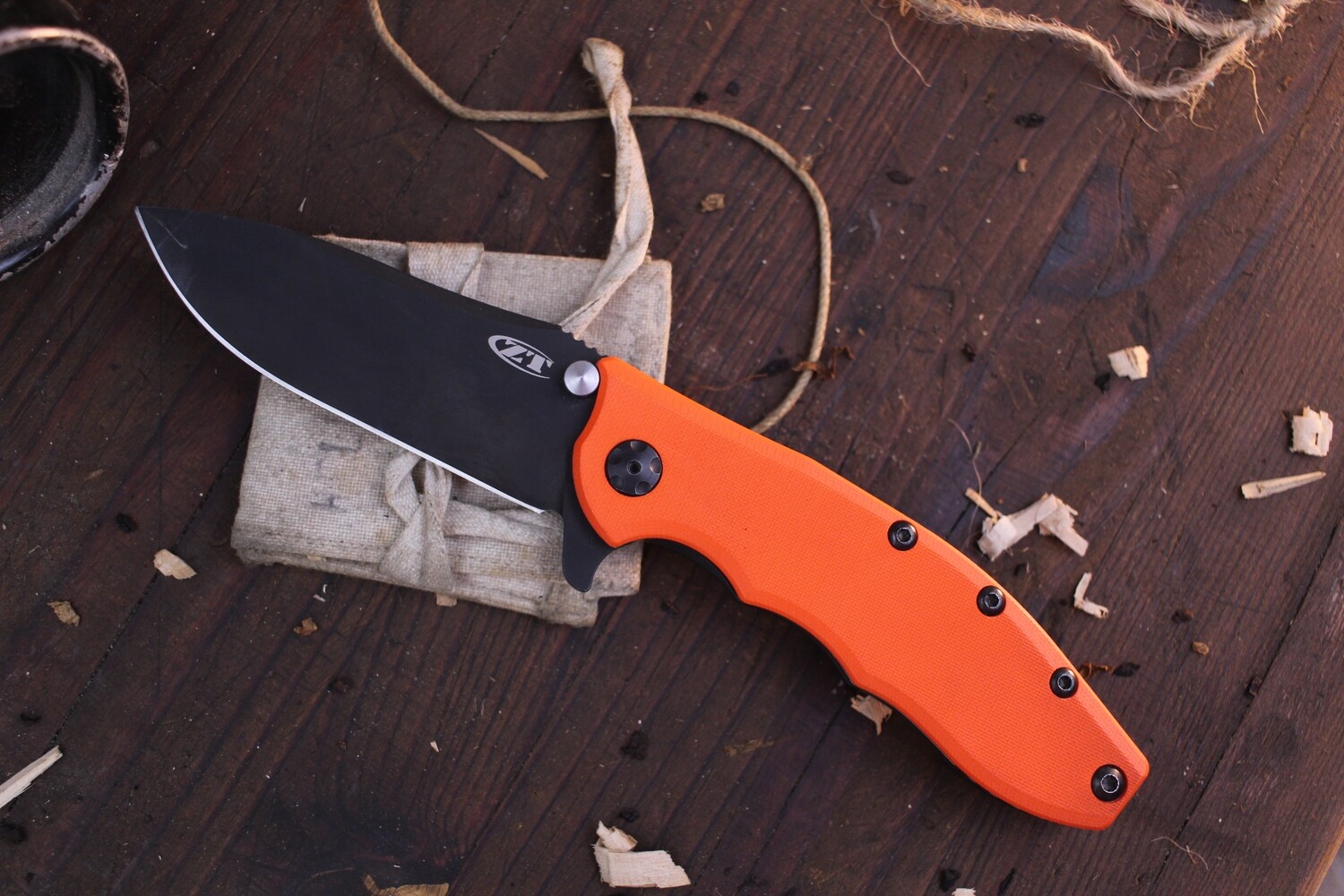 Zero Tolerance 0562ORBLK Hinderer 3.5&quot; Framelock Flipper / Orange G-10 / Black ( Pre Owned )