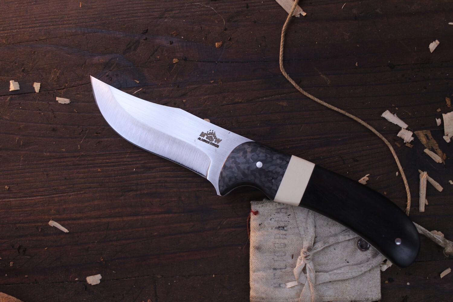 M&amp;W Alaskan Trifecta 3.25&quot; Clip Point Hunter / Ebony With Ivory Micarta Spacer &amp; Carbon Fiber Bolster / Satin AEB-L