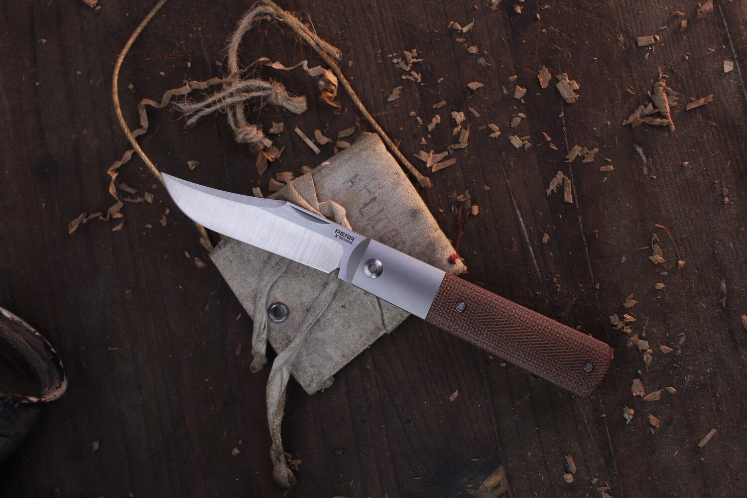 Pena X Series 2.875&quot; Barlow Front Flipper / Burlap Micarta &amp; Titanium / Satin M390 ( Pre Owned )