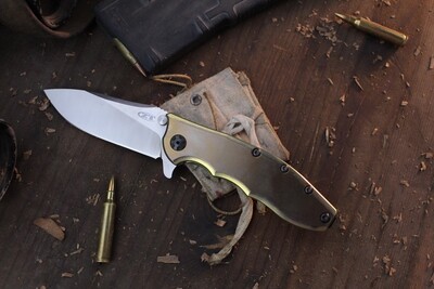 Zero Tolerance 0562TI Hinderer 3.5&quot; Framelock Flipper / Gold Anodized Titanium / Satin 20CV ( Pre Owned )