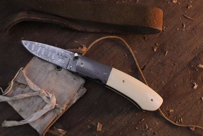 Don Dezarn 2.375" Custom LinerLock Folder / Creamy Ivory & Damascus Bolster / D. Thomas Basket Weave Damascus