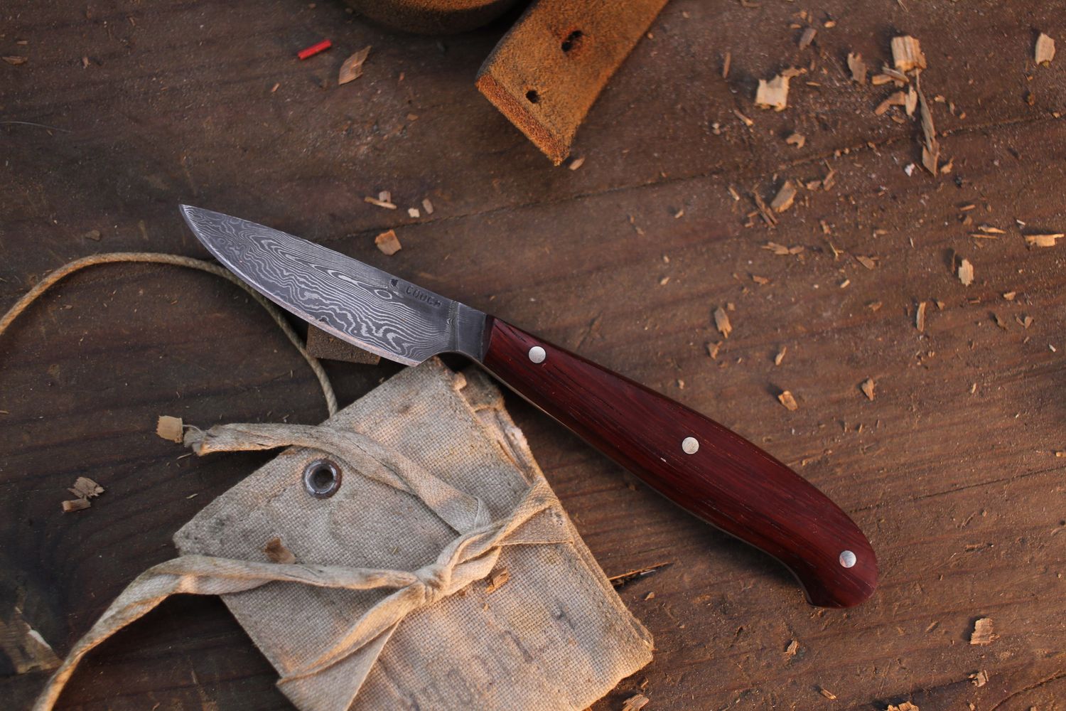 Mark Couch Small 2.365” Caper / Padauk / Alaskan Forged Damascus