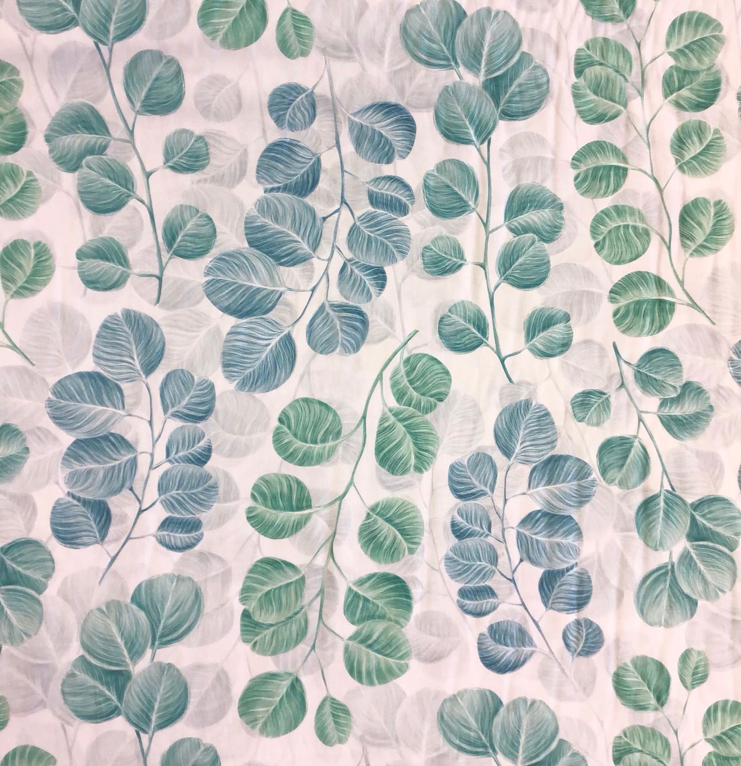 White Cotton with Green and Teal Leaves
