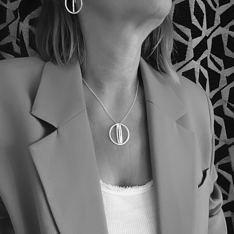 Silver pendant - round - handmade by jewelry designer Harry TiLLEY.