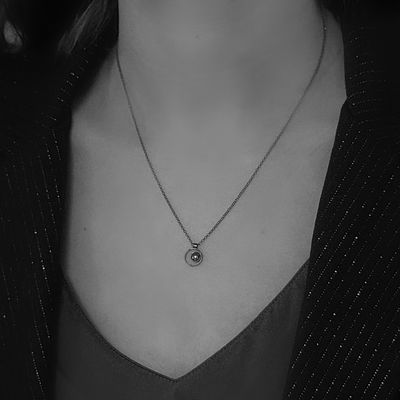 Small pendant with a black hematite stone finished in a black patina. Made in the Harry TiLLEY studio.