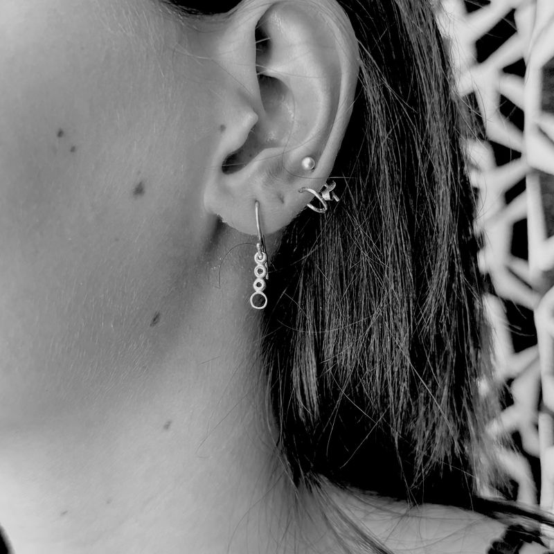 Gold-plated silver round earrings with balls and circles.
