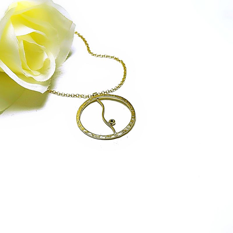 Gold-plated silver circle pendant with wavy detail