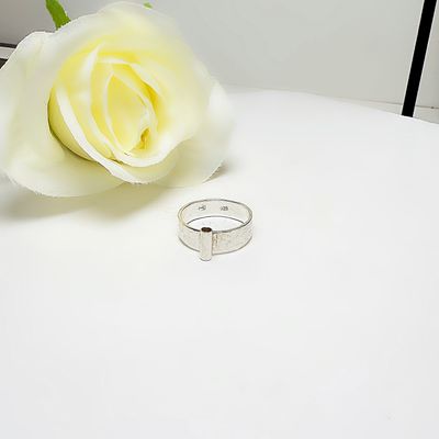 Silver ring with a tube at the front