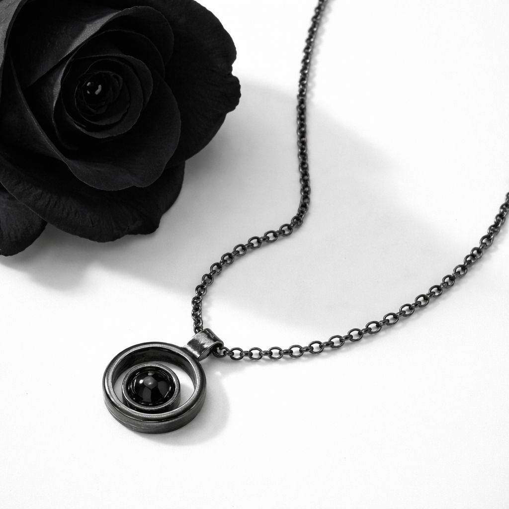 Small pendant with a black hematite stone finished in a black patina. Made in the Harry TiLLEY studio.