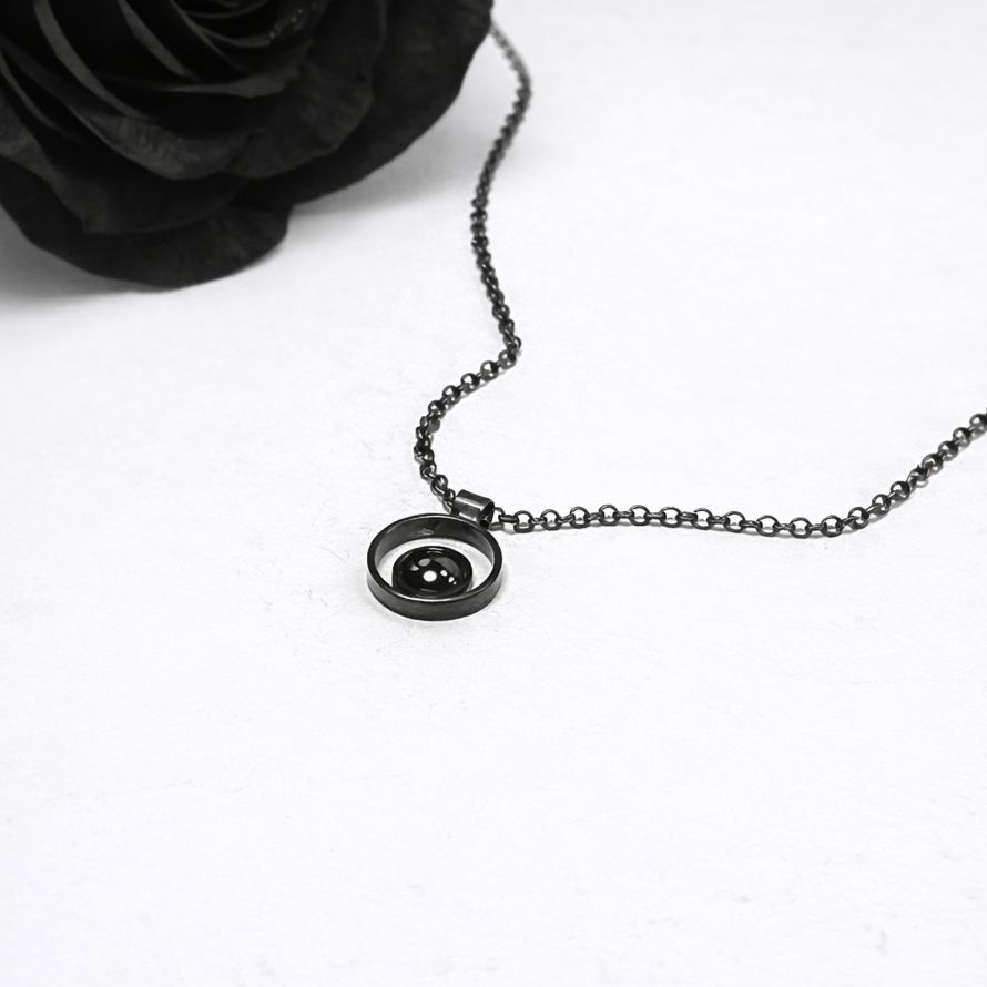 Small pendant with a black hematite stone finished in a black patina. Made in the Harry TiLLEY studio.