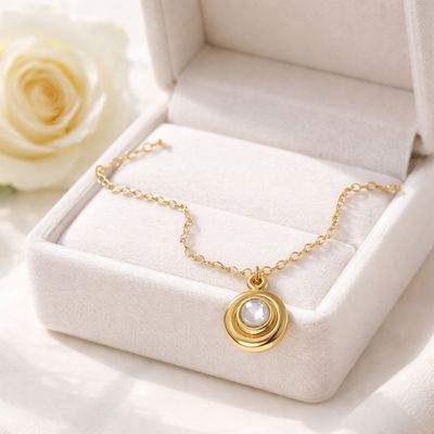 Gold-plated silver pendant - playful and with a natural stone - Harry TiLLEY creations