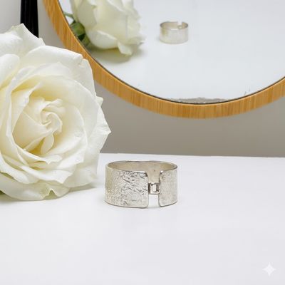 Silver wide ring with a small square detail at the front