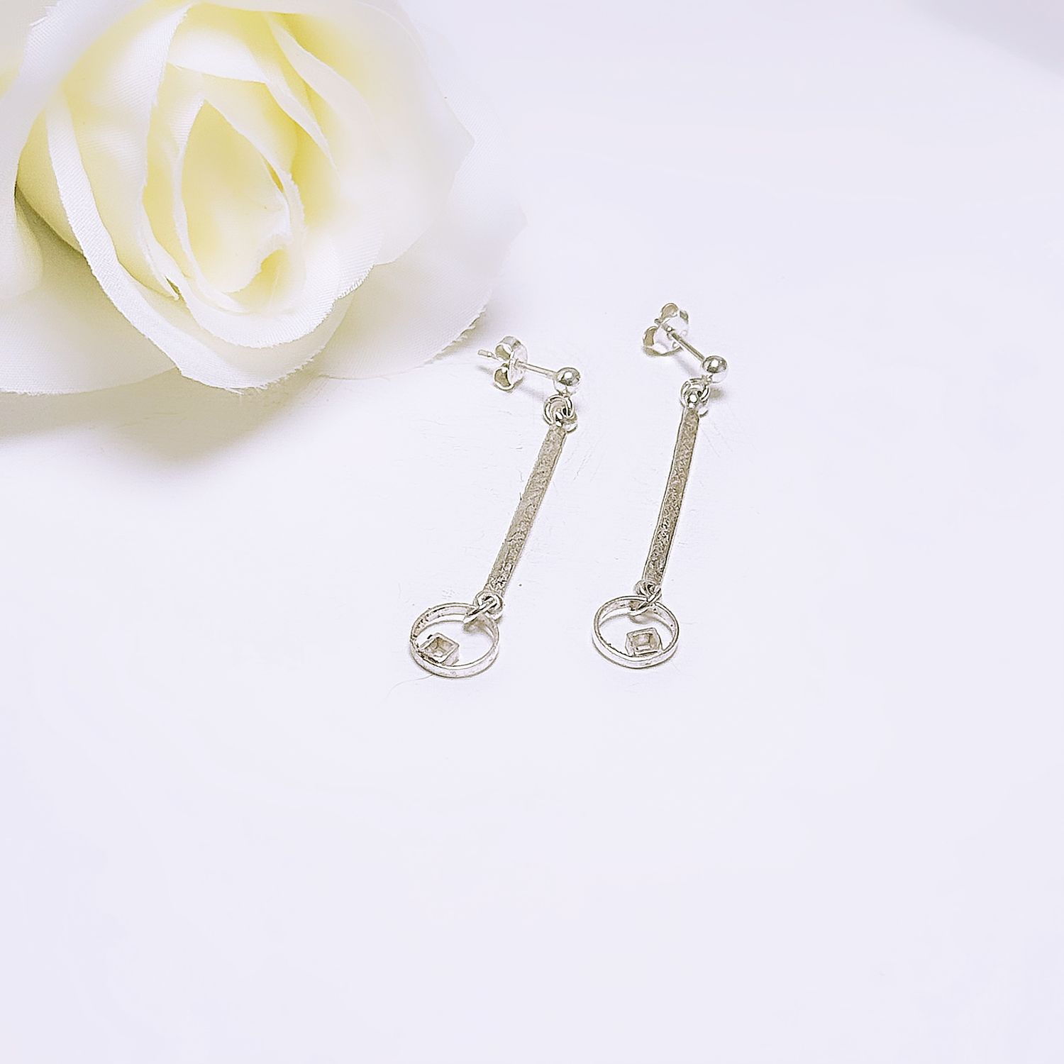 Silver stud earrings with bar circles and squares