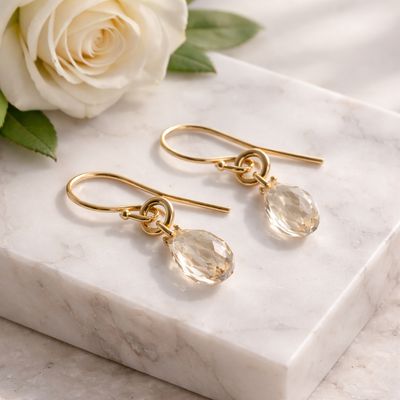Playful gold-plated earrings with shiny Swarovski stones
