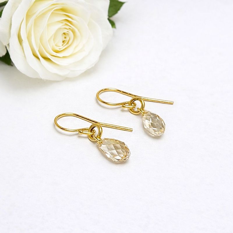 Playful gold-plated earrings with shiny Swarovski stones