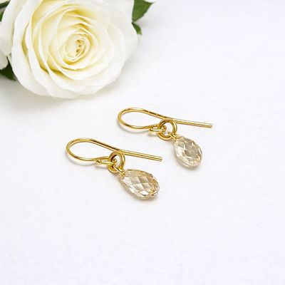 Playful gold-plated earrings with shiny Swarovski stones