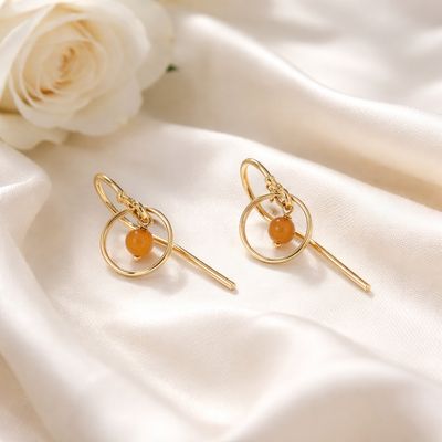 Playful gold-plated earrings with natural stones