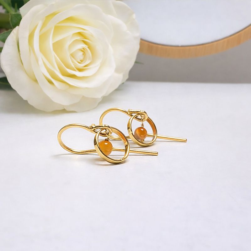 Playful gold-plated earrings with natural stones