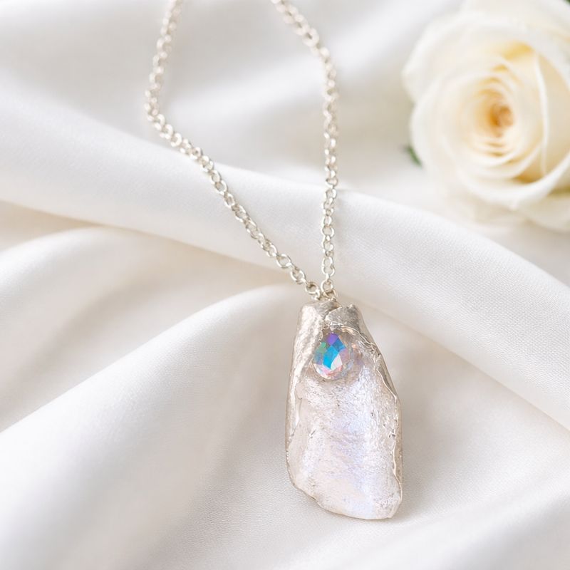 Folded silver pendant with rainbow Swarovski pearls