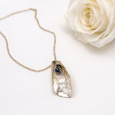 Folded silver pendant with rainbow Swarovski pearls