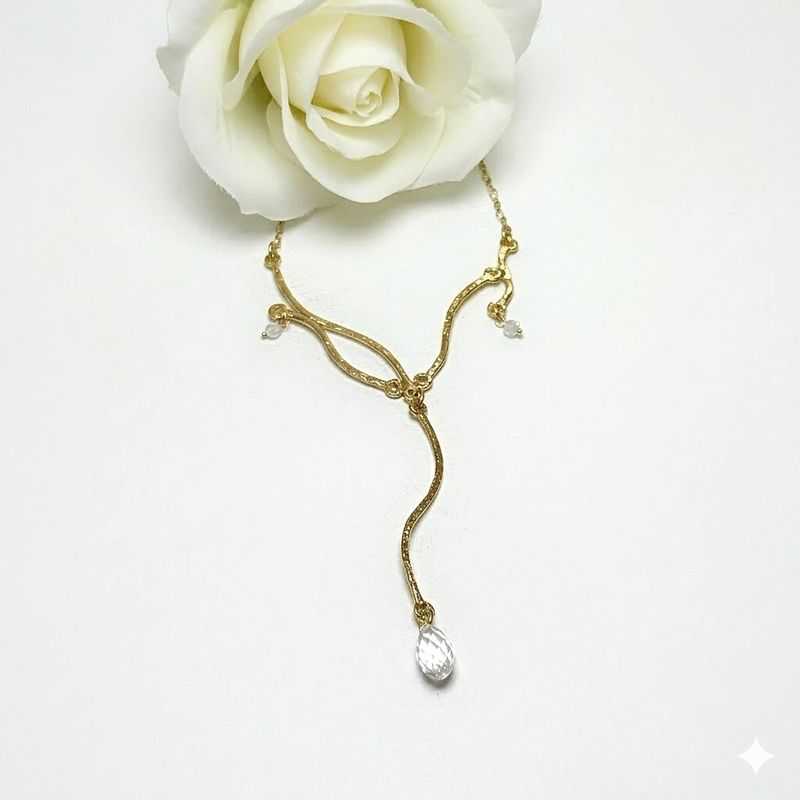 Beautiful long necklace with the waves of nature. Handmade in silver with an 18k gold plating.