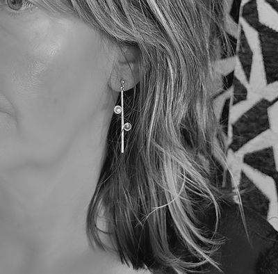 Sleek, straight stud earrings set with moonstones - Handmade by Harry TiLLEY